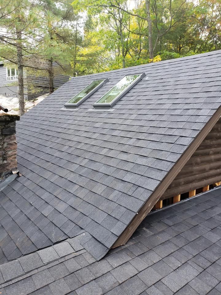Shingles around two skylights
